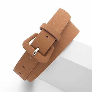 Minimalist brown leather belt with square fabric buckle and silver pin on white stand