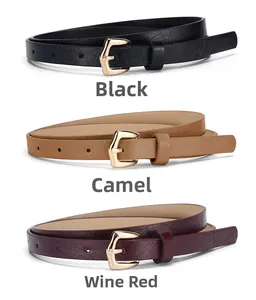 Close-up of thin PU leather belts in black, camel and wine red with gold pin buckles