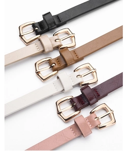 Detail of multi-color PU leather belts for women with golden buckles and fine stitching