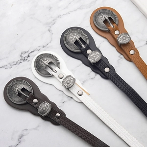 Vintage women's skinny belts with embossed patterns and western engraved buckles