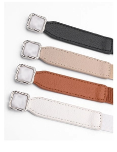 Detail showing elastic waist belts in black, beige, tan, and white with silver square buckles