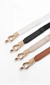 Detailed close-up of leather alloy belts in white black apricot and brown colors