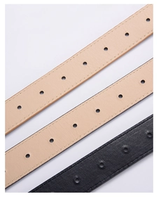 Détail de texture similicuir haut de gamme avec coutures fines et trous réglables sur ceintures