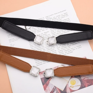 Elastic waist belts in black and brown with textured leather and square pearl buckle