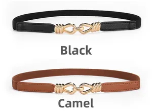 Detail of black and camel elastic waist belts with gold textured interlocking buckles