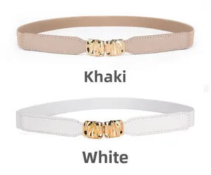 Detail showing elastic waist belts in khaki and white with golden leaf metal buckles