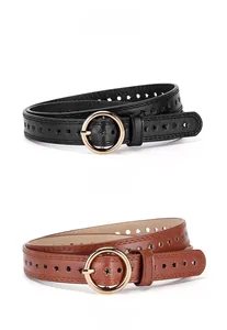 Detail of black and camel leather belts featuring star and round hollow punch patterns