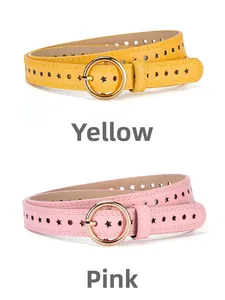 Close-up of yellow and pink slim belts with star-shaped cutouts and gold round buckles