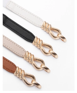 Detail of adjustable PU leather skinny belts in four colors with gold twist-knot buckles