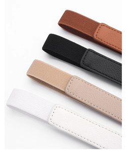 Close-up of four elastic waist belts showing woven texture and pebbled leather detail
