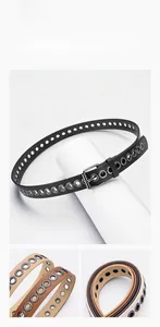 Close-up of slim multi-eyelet belts in black, brown and khaki with metal pin buckles