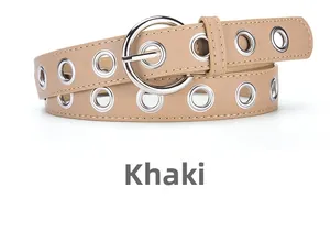 Detail of khaki slim belt featuring double-row silver metal eyelets and round pin buckle