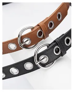Detail of punk style PU leather belts with silver alloy pin buckle and metal eyelets