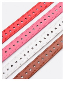 Detail of star-shaped cutouts and parallel stitching on colorful fashion belts