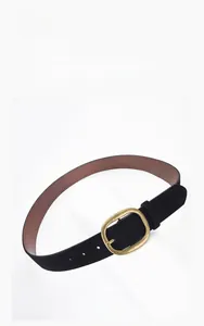 Detail of black faux suede women's belt showing gold oval buckle and matte texture