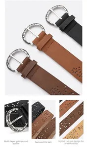 Detail of vintage carved metal buckle and hollow rose patterns on retro leather belts