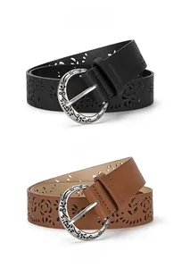 Close-up of black and camel hollowed-out belts with vintage floral embossed buckles