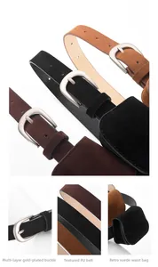 Détail de sacoches de ceinture vintage en daim avec boucles argentées classiques