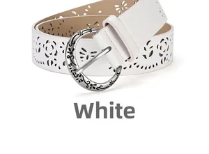 Detail of white vintage hollowed-out faux leather belt with floral silver buckle