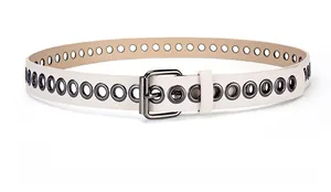 Detail of beige leather belt featuring decorative silver metal eyelets and a pin buckle