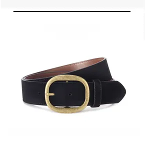 Close-up of black faux suede belt with vintage gold buckle and fine edge stitching