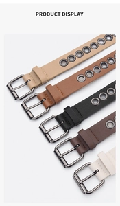 Detail of five assorted narrow faux leather belts with metallic eyelets and square buckles