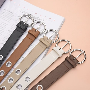 Women's punk style faux leather belts with metal eyelets and round silver buckles