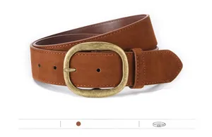 Detailed macro view of camel faux suede women's belt with a vintage gold metal buckle