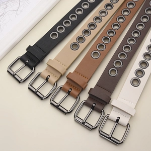 Five assorted skinny faux leather grommet belts with metal buckles for women's dresses