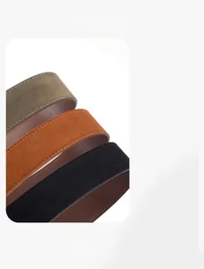 Close-up of faux suede belts in dark green, caramel, and black with fine stitching