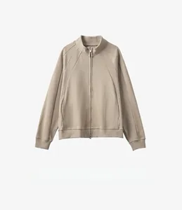 Macro detail of high-quality zipper and stitching on earth tone men's stand collar jacket