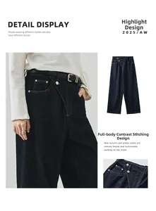 Detail der dunkelblauen Wide-Leg-Jeans mit orangefarbenen Kontrastnähten und schrägem Verschluss