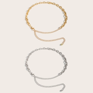 Detailed view of gold and silver hollow metal waist chains with polished texture