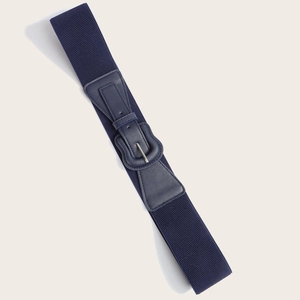 Detailed macro view of the navy blue elastic wide waist belt with a faux leather buckle