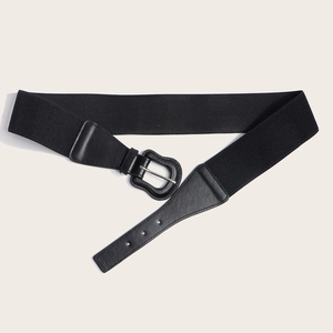 Detail of a wide black elastic belt featuring premium faux leather and silver metal buckle