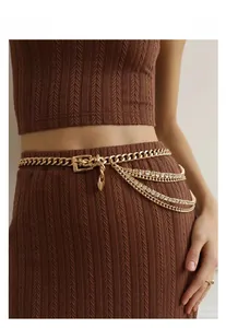 Elegant gold-tone multi-layer chain belt featuring sparkling rhinestones and heart charms
