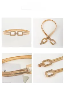 Close-up of golden elastic waist chain with minimalist geometric interlocking buckle detail