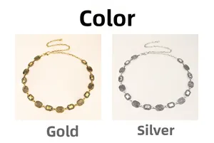 Detailed view of metal waist chain with oval textured links in gold and silver finish