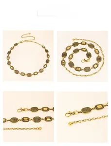 Detail of vintage gold chain belt showing oval links and adjustable lobster clasp
