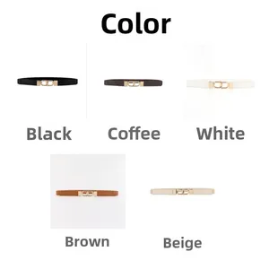 Detail showing five colors of slim faux leather belts with golden interlocking buckles