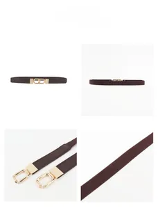 Detail of slim brown elastic waist belt with gold double ring buckle and leather拼接