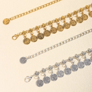Bohemian metalen tailleketting met vintage munt hangers in goud en zilveren afwerking