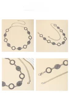 Detail view of vintage silver metal chain belt with bohemian oval textured plates