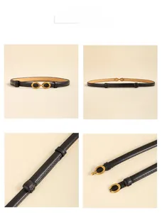 Vue détaillée d'une ceinture fine en cuir noir avec boucle double anneau doré ovale