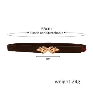 Women's dark brown stretch belt with a vintage gold leaf buckle and elastic band