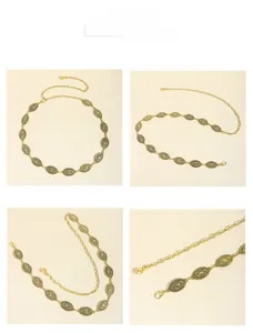 Detail of vintage bohemian gold metal waist chain with geometric engraved oval discs