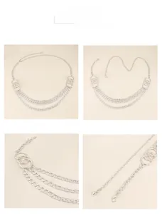 Detailed macro view of silver multilayer metal waist chain with rings and lobster clasp