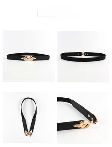 Detail of leaf-shaped gold buckle on black elastic waist belt for women's dresses