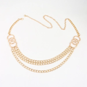 Detail of a triple-layered gold curb chain waist belt with adjustable lobster clasp