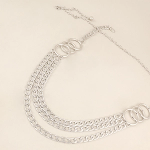Detail of silver multi-layer metal chain belt with large rings and adjustable clasp